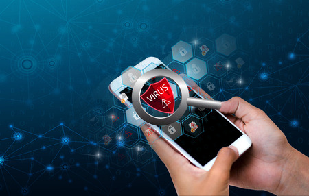 Red Shield Virus Internet phone Smartphone is protected from hacker attacks, Firewall Businesspeople press the protected phone on the internet. space put messageの写真素材