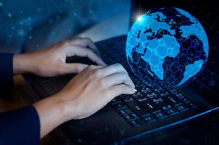 Press enter button on the computer. business logistics Communication network World map send message Connect worldwide hand keyboard Communications network map of the world Blue map Dark blue background map world global logistics networkの写真素材