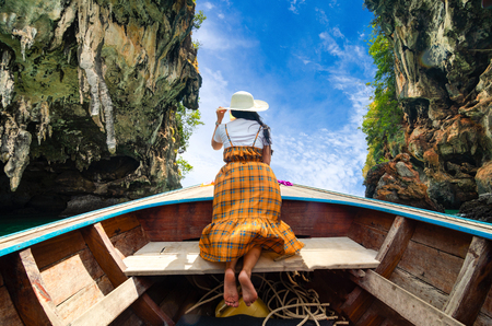 Koh Kai Women are glad on the wooden boat Krabi Thailandの写真素材