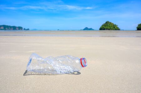 garbage the beach sea plastic bottle lies on the beach and pollutes the sea and the life of marine life Spilled garbage on the beach of the big city. Empty used dirty plastic bottlesの写真素材
