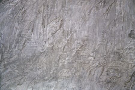 background Plaster Rough gray cement mortar used as a design backgroundの写真素材