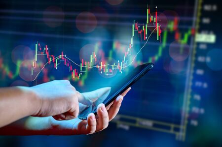 Graph of financial growth global communications Binary Smart Phones and world Internet Businesspeople press the phone to communicate in the Internet Stock chart Researching process.business Team Working Startup modern office Laptop global strategy virtual Icon.Innovation graphs Interfacesの写真素材