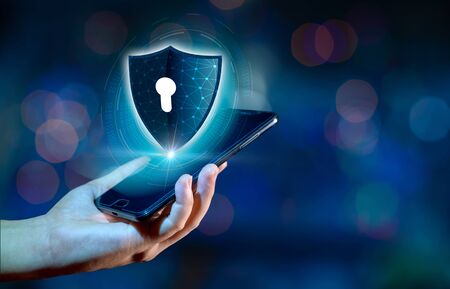 Shield Internet phone Smartphone is protected from hacker attacks, Firewall Businesspeople press the protected phone on the internet. space put messageの写真素材