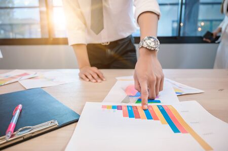 Business people are meeting and graphing business growth on a deskの写真素材