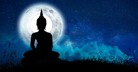 The Buddha meditated among many stars and a large moon.の写真素材