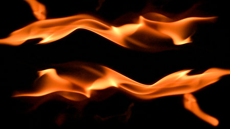 fire background burning flame frame on a black backgroundの写真素材