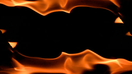 fire background burning flame frame on a black backgroundの写真素材