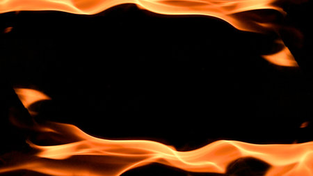 fire background burning flame frame on a black backgroundの写真素材
