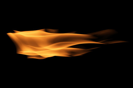 Flames on black background. Fire blaze flames on black background. Fire burn flame isolated, abstract texture. Flaming explosion effect with burning fire.の写真素材