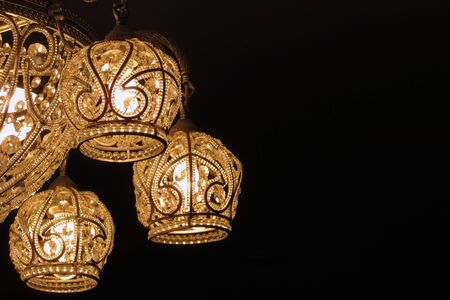 vintage chandelier on black backgroundの写真素材