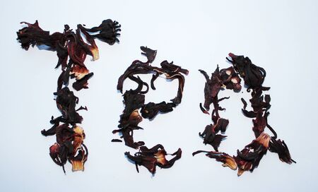 inscription tea red petals of white background isolateの写真素材