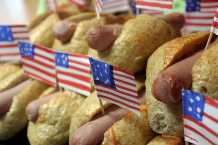 American hot dogs with small American flags close plan, bun and sausageの写真素材