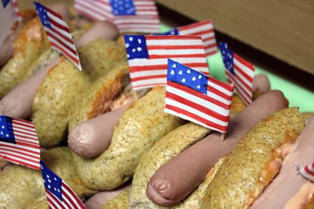 American hot dogs with small American flags close plan, bun and sausageの写真素材