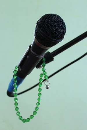 Microphone on a green backgroundの写真素材