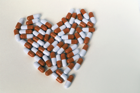 Pills heart heart on white background isolate medicineの写真素材