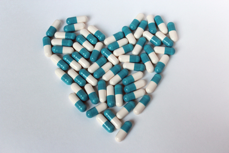 Pills heart heart on white background isolate medicineの写真素材