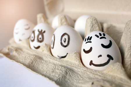 Eggs chicken in packing close-up white clean smiling faces funny funny funny faces