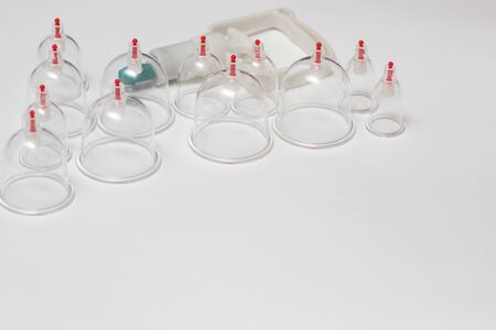 Jars for hijama. Vacuum pumps on a white backgroundの写真素材