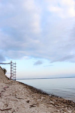 Sea shore. Hill and high stairs to the pier.の写真素材