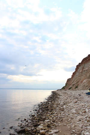 Sea shore. Cloudy day. The stone coast.の写真素材