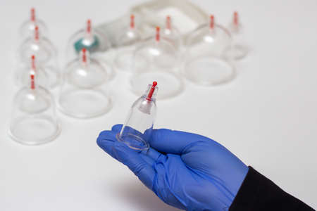 Jars for hijama. Vacuum pumps on a white backgroundの写真素材