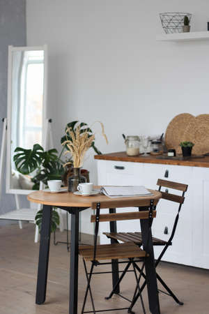 White kitchen, tables and chairsの写真素材
