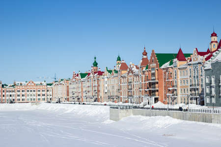 Waterfront houses in the city of Yoshkar-Ola, in Russia. Winter snow. Sights of the city of Yoshkar-Ola. Colorful houses.の写真素材