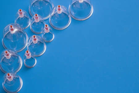 Jars for hijama. Vacuum pumps on a blue backgroundの写真素材