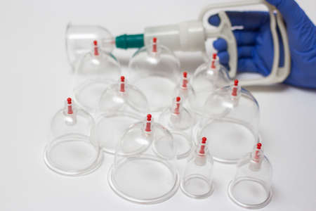 Jars for hijama. Vacuum pumps on a white backgroundの写真素材