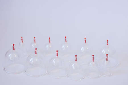 Jars for hijama. Vacuum pumps on a white background