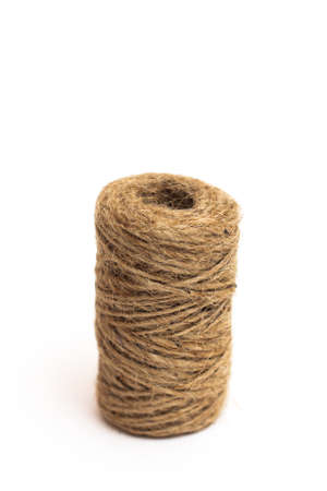 A skein of brown twine on a white background. Isolate.
