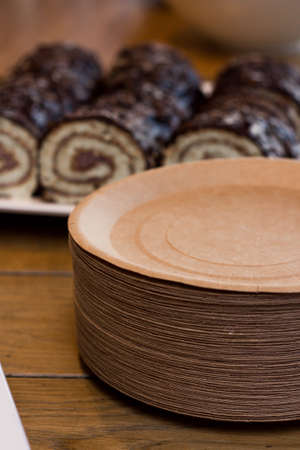 Paper plates with chocolate rolls. Disposable paper platesの写真素材