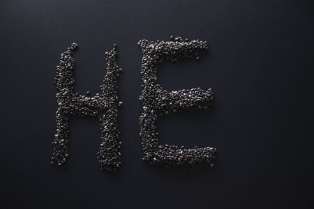 Word HE written with chia seeds on gray background, top view, copy space.の写真素材