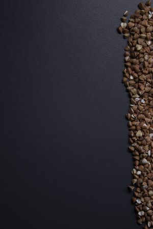 strip written with buckwheat On gray background, top view, copy space. Food supplies crisis, food donation on quarantine isolation period.の写真素材