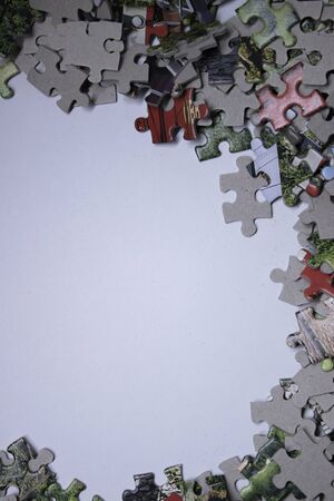 multicoloured puzzles on a white background. isolated. Top view, copy space. . High quality photoの写真素材