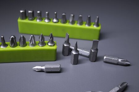 A set of building tools and instruments for repair in black and green colour. Must-have for men. Equipment for building. Repair tool kit. construction concept. gray background . High quality photoの写真素材