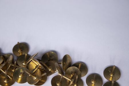 golden pins. stationery concept. copy space. isolated. High quality photoの写真素材