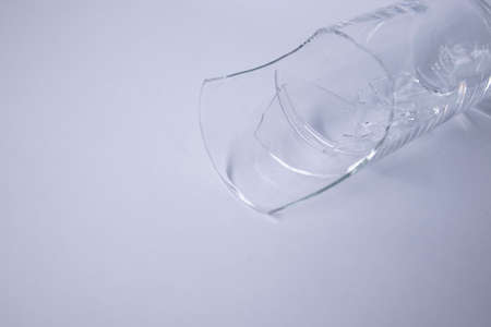 fragments of a broken glass in a broken glass on a white background. Isolated. Copy space. High quality photoの写真素材