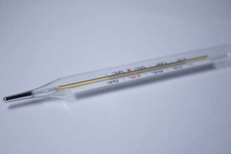 mercury thermometer on a white background. medicine and disease concept. Isolated. High quality...