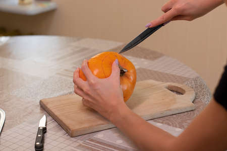 the process of making a Halloween pumpkin. horror theme and Halloween.