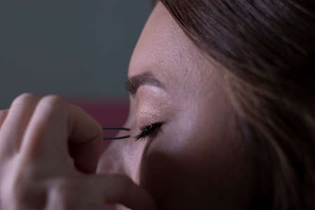 process of applying makeup to beautiful brunette. beauty and cosmetics concept.