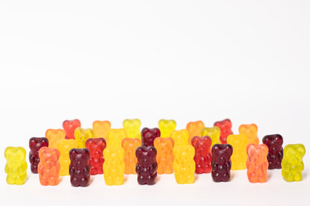 colorful sweet gummy bears isolated on white background.
