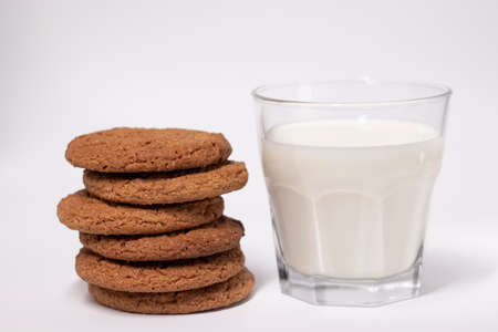 oat cookies with a glass of milk isolated on white background.の写真素材
