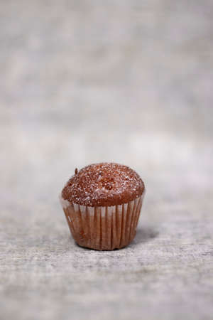 muffin cupcake covered in powdered sugar. sweet bakeryの写真素材