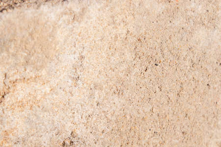 texture of stone concrete wall. cracked sand brick. pastel background solid.の写真素材