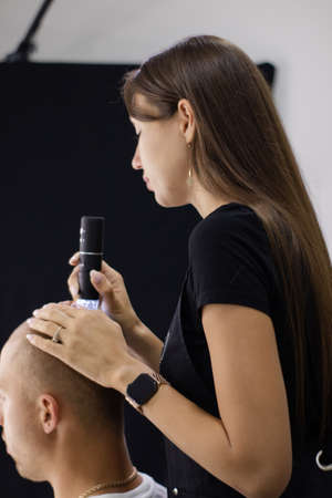 Trichoscope examination of hair, scalp and hair follicles of a young man. copyspace. The head of a...
