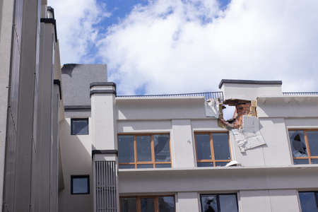 War in Ukraine. abandoned home. russian troops bombing peaceful city. War refugees in Ukraine. destroyed and burned apartment building. irpin 2022. Russian invasion. bomb and missile attack.の写真素材