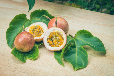 Passion fruits on wooden backgroundの写真素材