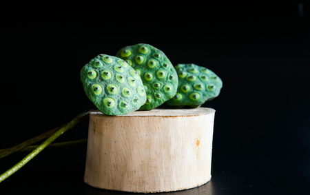 Lotus seeds on black background.の写真素材