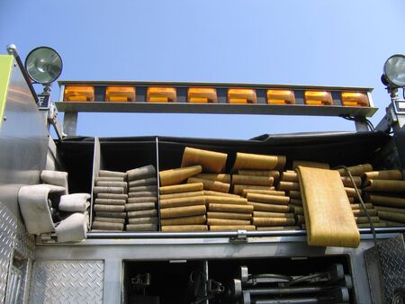 Hoses Stacked Up On The Back End Of a Fire Engine